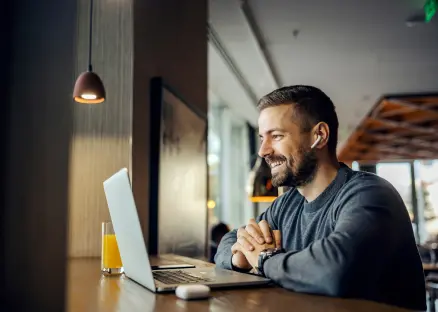Man using laptop for social media
